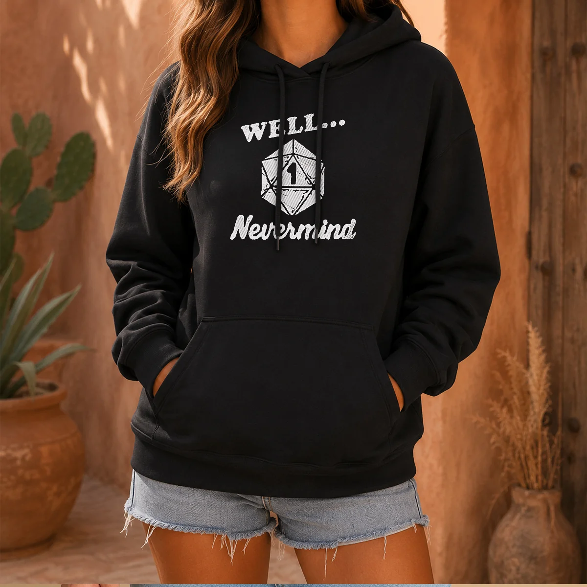 Good Well Nevermind D20 Dice Roll One Hoodie in black with front graphic design and adjustable drawstring hood
