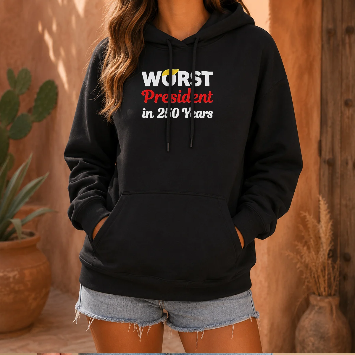 Hot Worst President In 250 Years Hoodie in black, front view with drawstring hood and kangaroo pocket