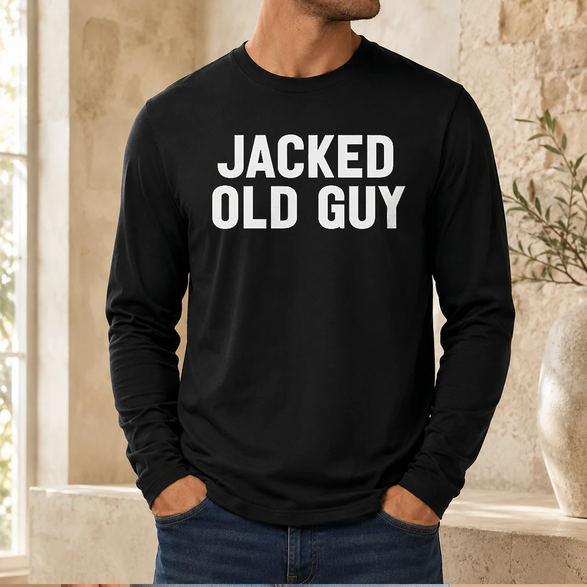 Premium Jacked Old Guy Long Sleeve Shirt in dark color displayed on a male model, showing front chest design clearly